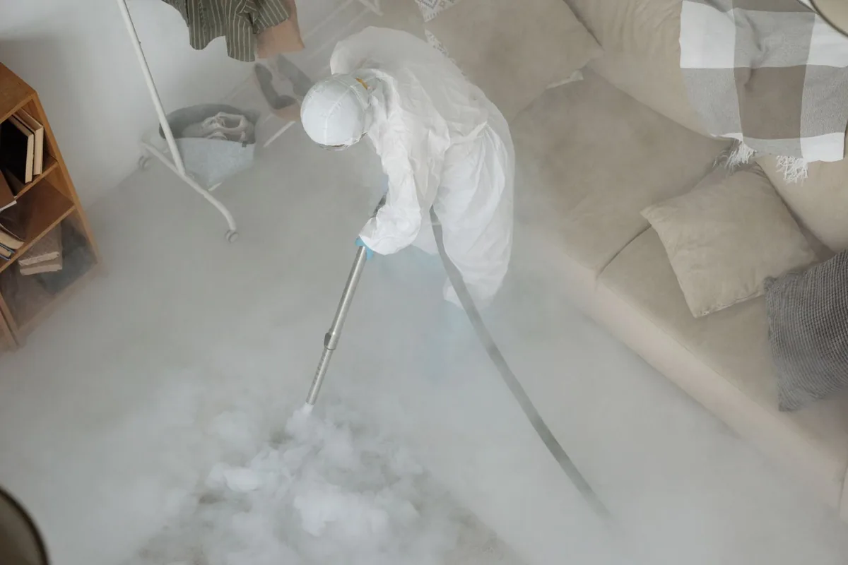 Biohazard cleanup technician in protective equipment, Lake Shore, WA